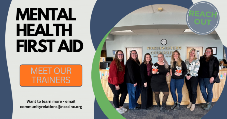 Seven women stand together, smiling, in front of a Northwestern Counseling & Support Services desk. Text on the left promotes Mental Health First Aid and invites viewers to meet the trainers.